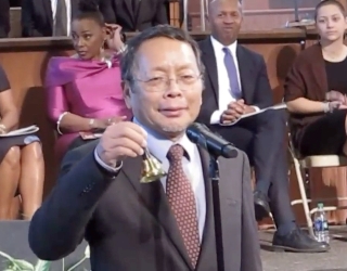 MLK Gandhi_L.T. Ngaihte ringing the bell_Slide.jpg